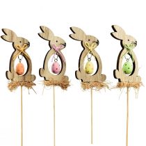 Artículo Tapón de flores tapón decorativo de madera conejo con huevo 5x8,5cm 12 piezas