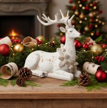 Artículo Figura decorativa de un ciervo sentado con astas, 30 cm.