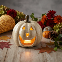 Artículo Decoración de calabaza de cerámica con LED y cara sonriente, 13 cm.