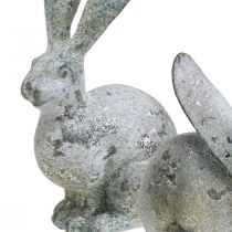 Artículo Conejito decorativo, figura de jardín con aspecto de hormigón, shabby chic, decoración de Pascua con detalles plateados Al. 21/14 cm, juego de 2