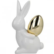 Artículo Conejos con huevo de oro, conejos de cerámica para Pascua blanco noble, dorado H13cm 2pcs