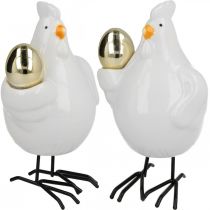 Artículo Gallina decorativa con huevo dorado, figura de Pascua porcelana, decoración Pascua gallina H12cm 2pcs