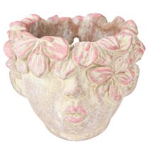 Artículo Maceta colgante con forma de cabeza de planta, aspecto hormigón, color rosa, altura 13 cm.