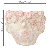 Artículo Maceta colgante con forma de cabeza de planta, aspecto hormigón, color rosa, altura 13 cm.