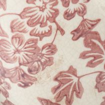 Artículo Maceta decorativa con asa, diseño floral, 21 cm.