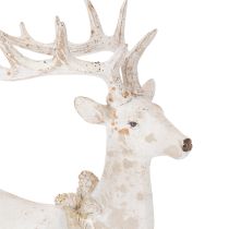 Artículo Figura decorativa de un ciervo sentado con astas, 30 cm.