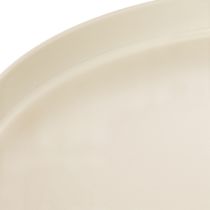 Artículo Bandeja redonda decorativa en color crema, de 30 cm, con soporte para decoración de mesa.