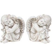 Artículo Figura decorativa de ángel de luto sentado color crema 6,5×5×7,5cm 2 piezas