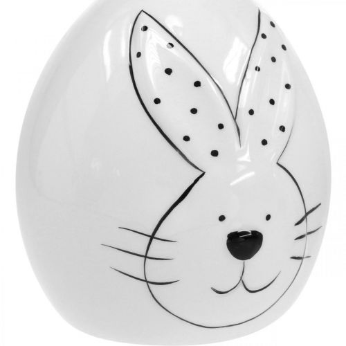 Artículo Huevo decorativo de cerámica con conejo, Decoración de Pascua moderna, Huevo de Pascua con motivo de conejo Ø11cm H12.5cm juego de 4