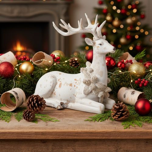 Figura decorativa de un ciervo sentado con astas, 30 cm. | Floristik24.es