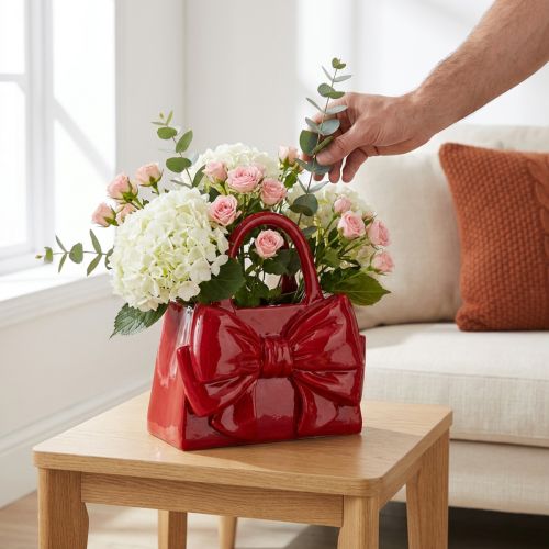 Artículo Jarrón decorativo con forma de bolso y lazo, acabado brillante, 22 cm.