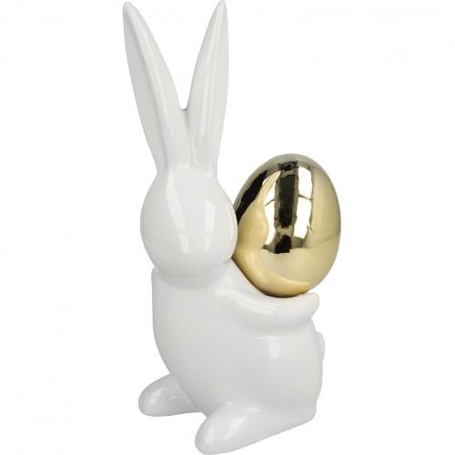 Floristik24 Conejitos de Pascua elegantes, conejitos de cerámica con huevo dorado, decoración de Pascua blanco, dorado H18cm 2pcs