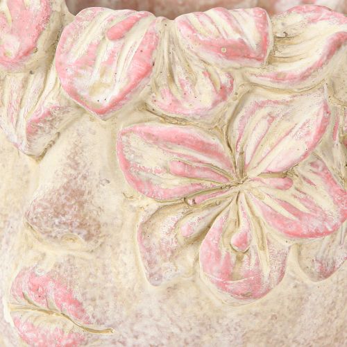 Artículo Maceta colgante con forma de cabeza de planta, aspecto hormigón, color rosa, altura 13 cm.