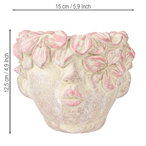 Artículo Maceta colgante con forma de cabeza de planta, aspecto hormigón, color rosa, altura 13 cm.