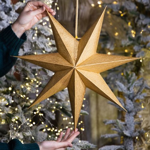 Artículo Estrellas de papel festivas para decoraciones de Adviento y Navidad.