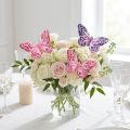 Mariposas decorativas sobre plumas de alambre rosa violeta 7×10cm 12 piezas | Floristik24.es