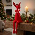 Figura decorativa de alce con lazo, sentado, para colocar sobre estante, 54 cm. | Floristik24.es