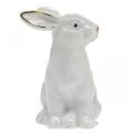 Floristik24 Conejo de cerámica blanca, decoración de Pascua con decoración dorada, decoración de primavera Al. 7,5 cm