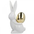 Floristik24 Conejitos de Pascua elegantes, conejitos de cerámica con huevo dorado, decoración de Pascua blanco, dorado H18cm 2pcs