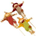 Figura decorativa de espantapájaros sobre un palo para manualidades y plantas, 60 cm. | Floristik24.es